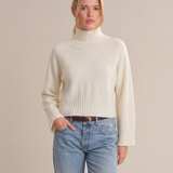 a woman in a white sweater