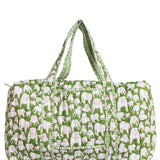 a green and white duffel bag