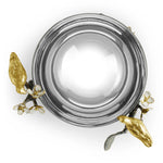 a silver bowl with gold leaves and flowers