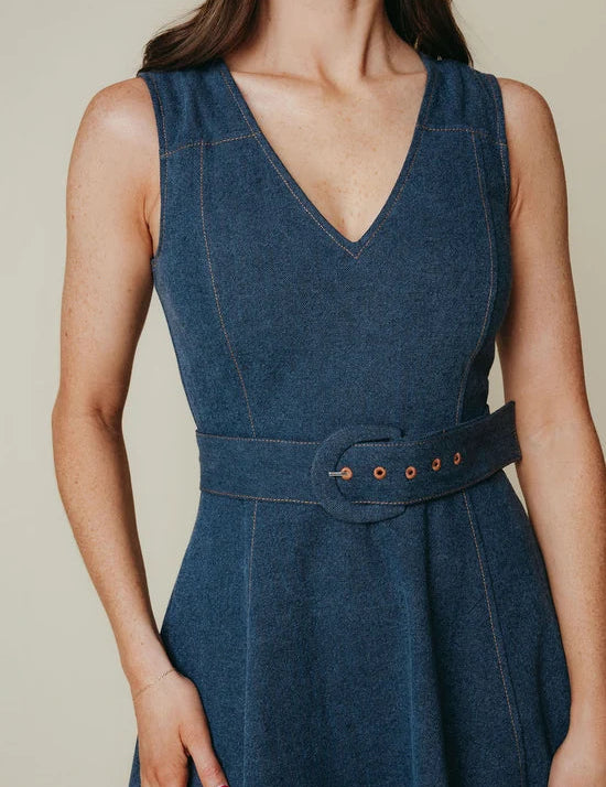 a woman wearing a blue dress