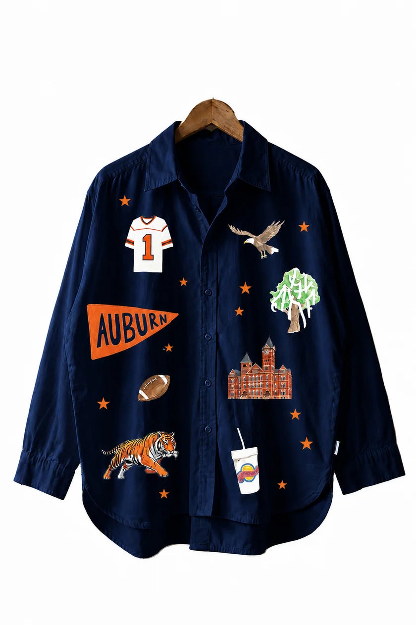 a blue shirt with stickers on it