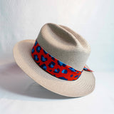a hat with a red and blue ribbon