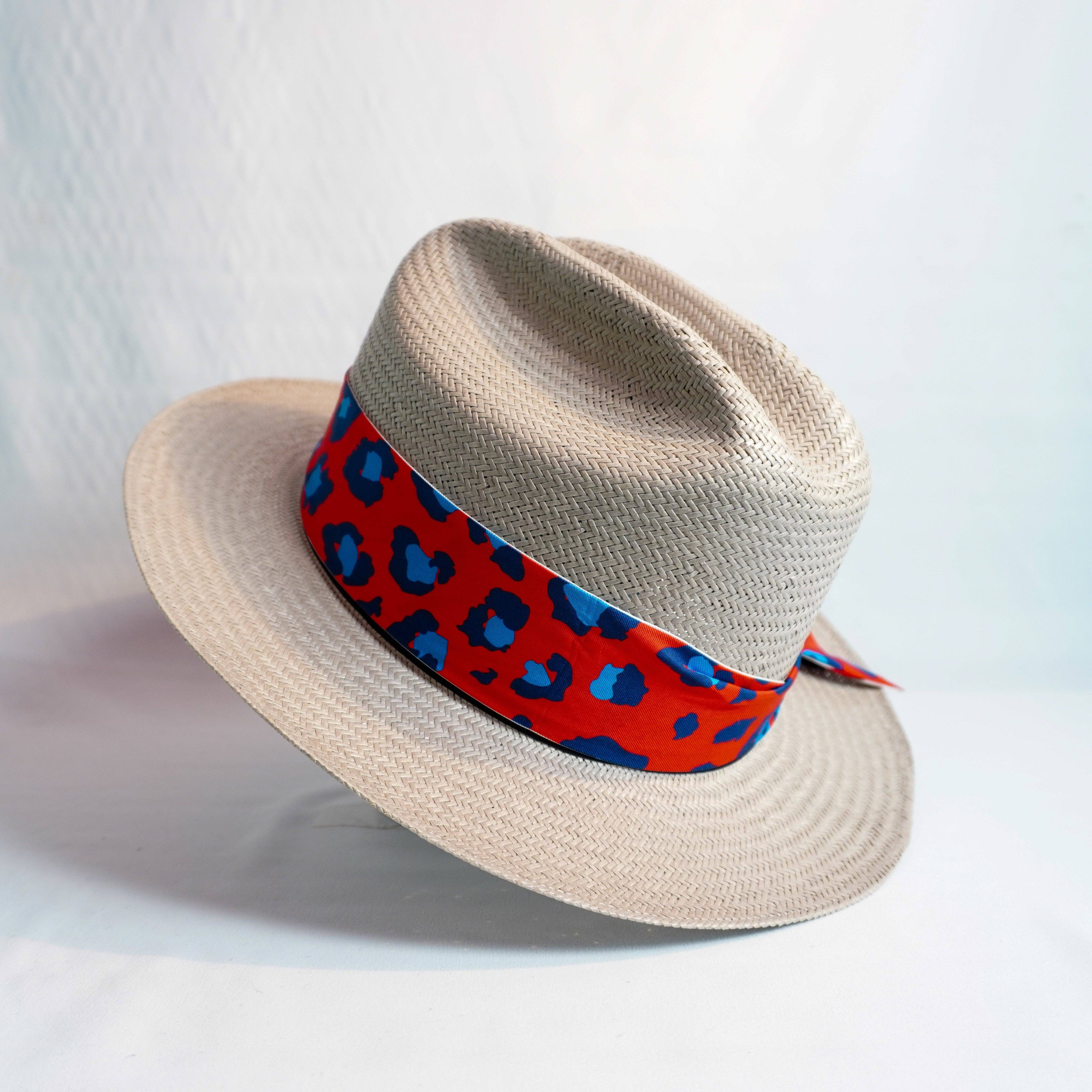 a hat with a red and blue ribbon