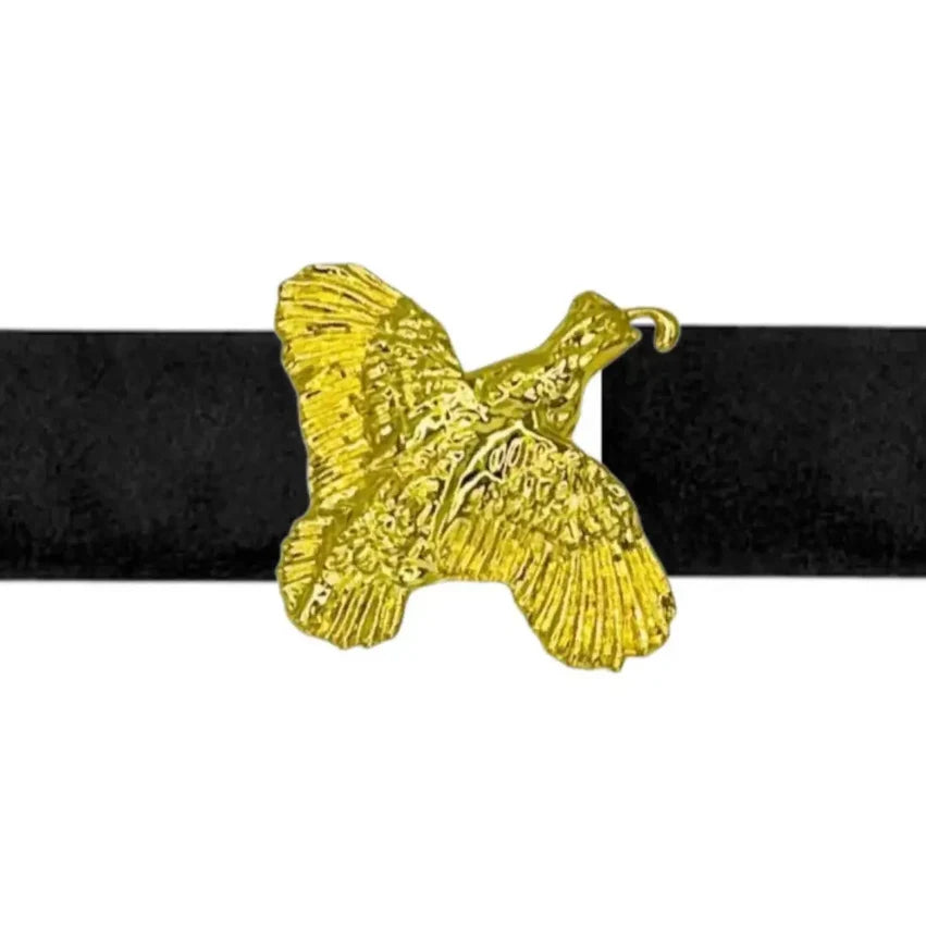 a gold bird on a black belt