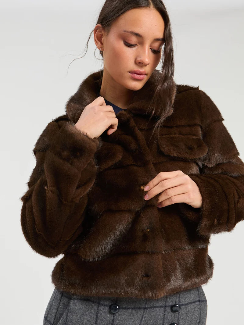a woman in a fur coat