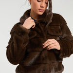 a woman in a fur coat