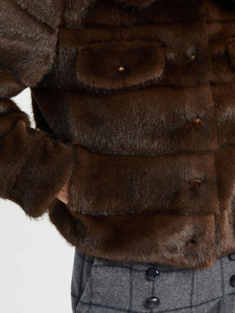 a person wearing a fur coat