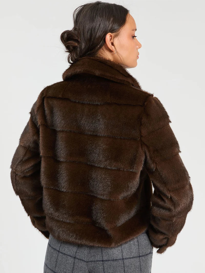 a woman in a fur coat