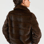a woman in a fur coat