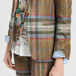 a person wearing a plaid suit