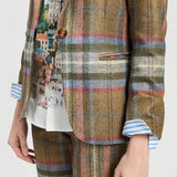 a person wearing a plaid suit