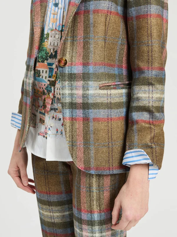 a person wearing a plaid suit