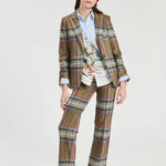a woman in a plaid suit