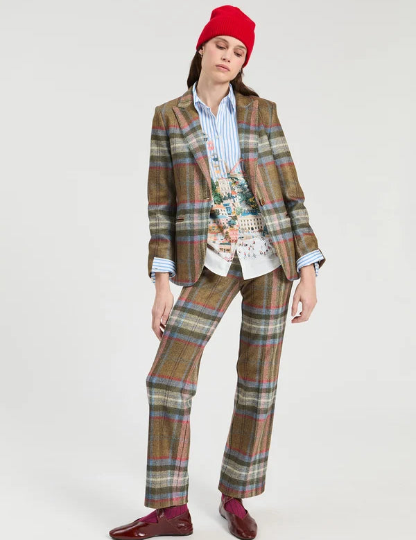 a woman in a plaid suit