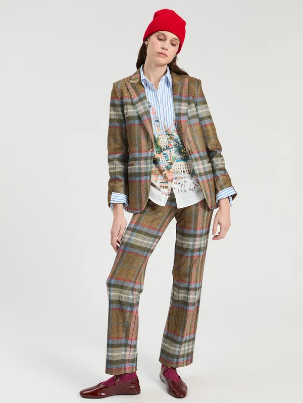 a woman in a plaid suit