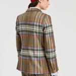 a woman in a plaid suit