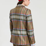 a woman in a plaid suit