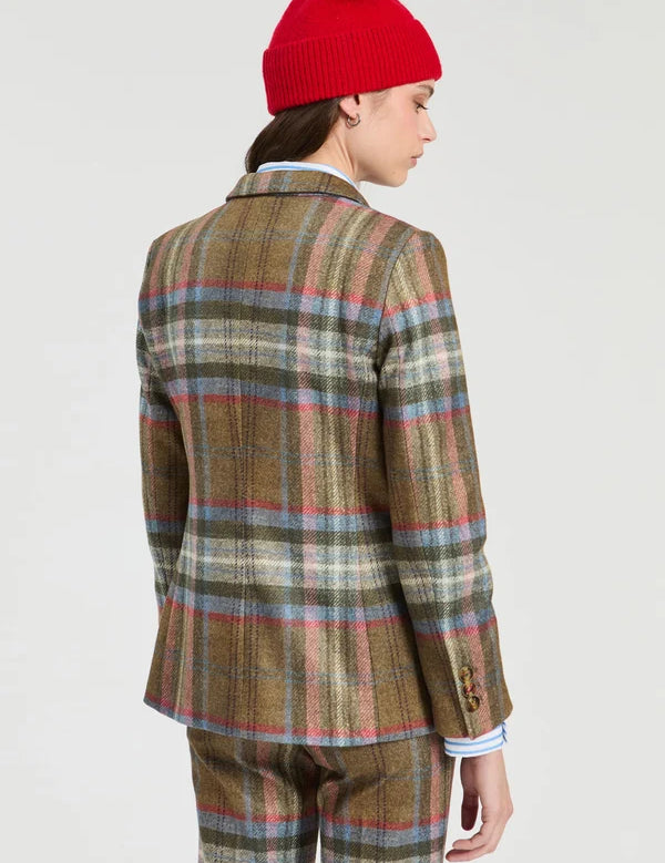 a woman in a plaid suit