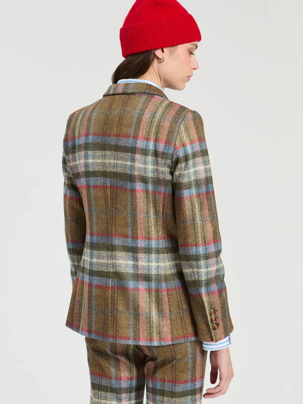 a woman in a plaid suit