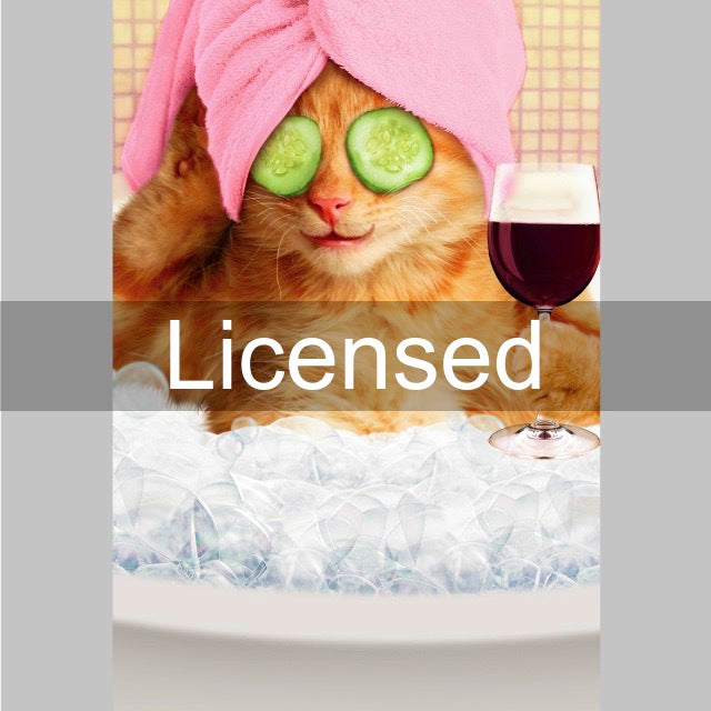 a cat with cucumber on its head and a glass of wine