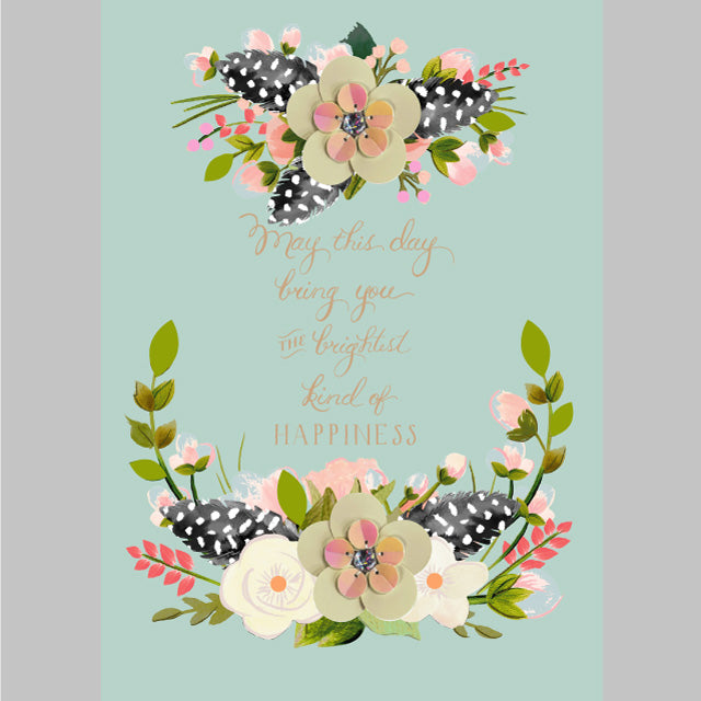 a card with flowers and feathers