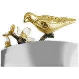 a gold bird on a silver bowl