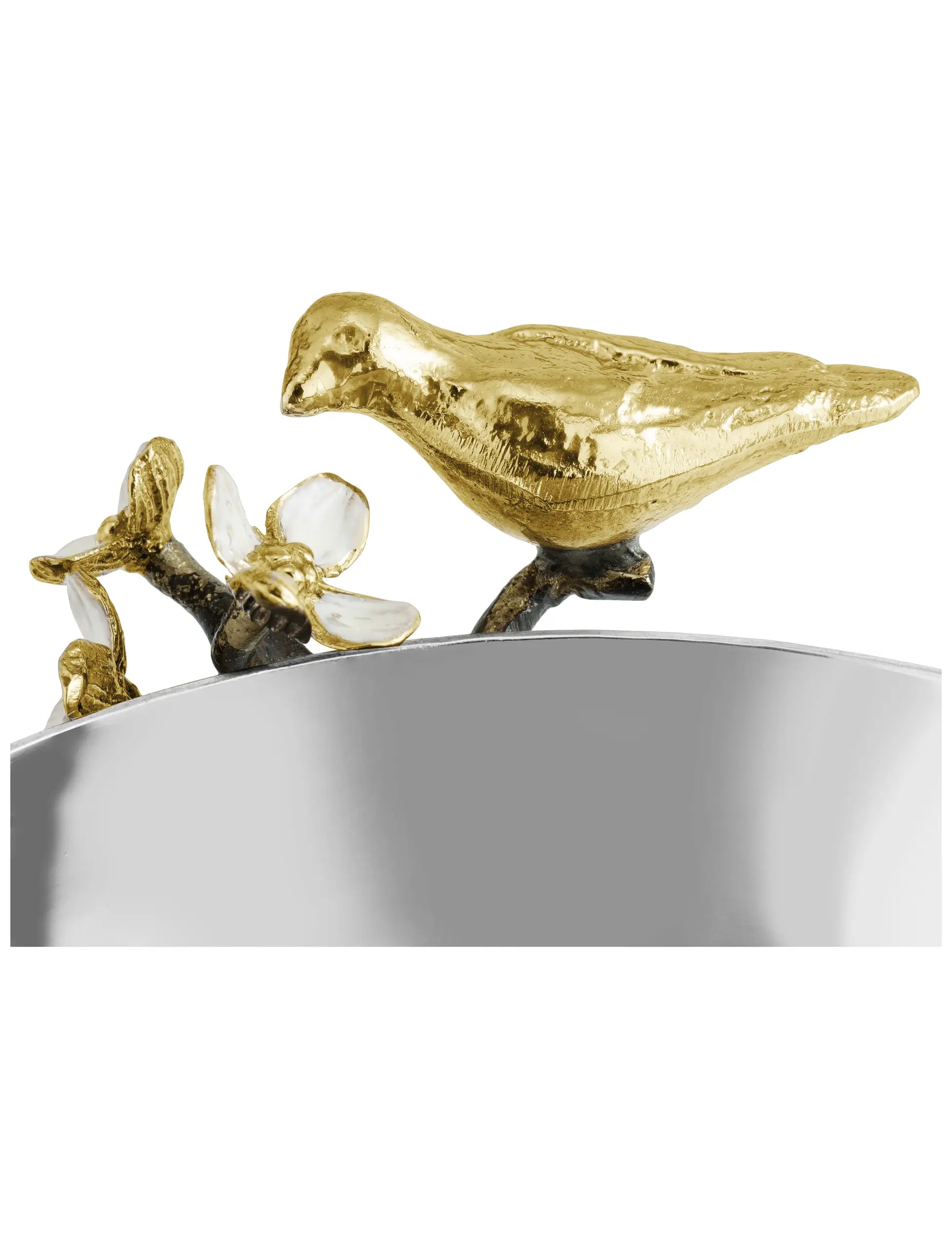 a gold bird on a silver bowl