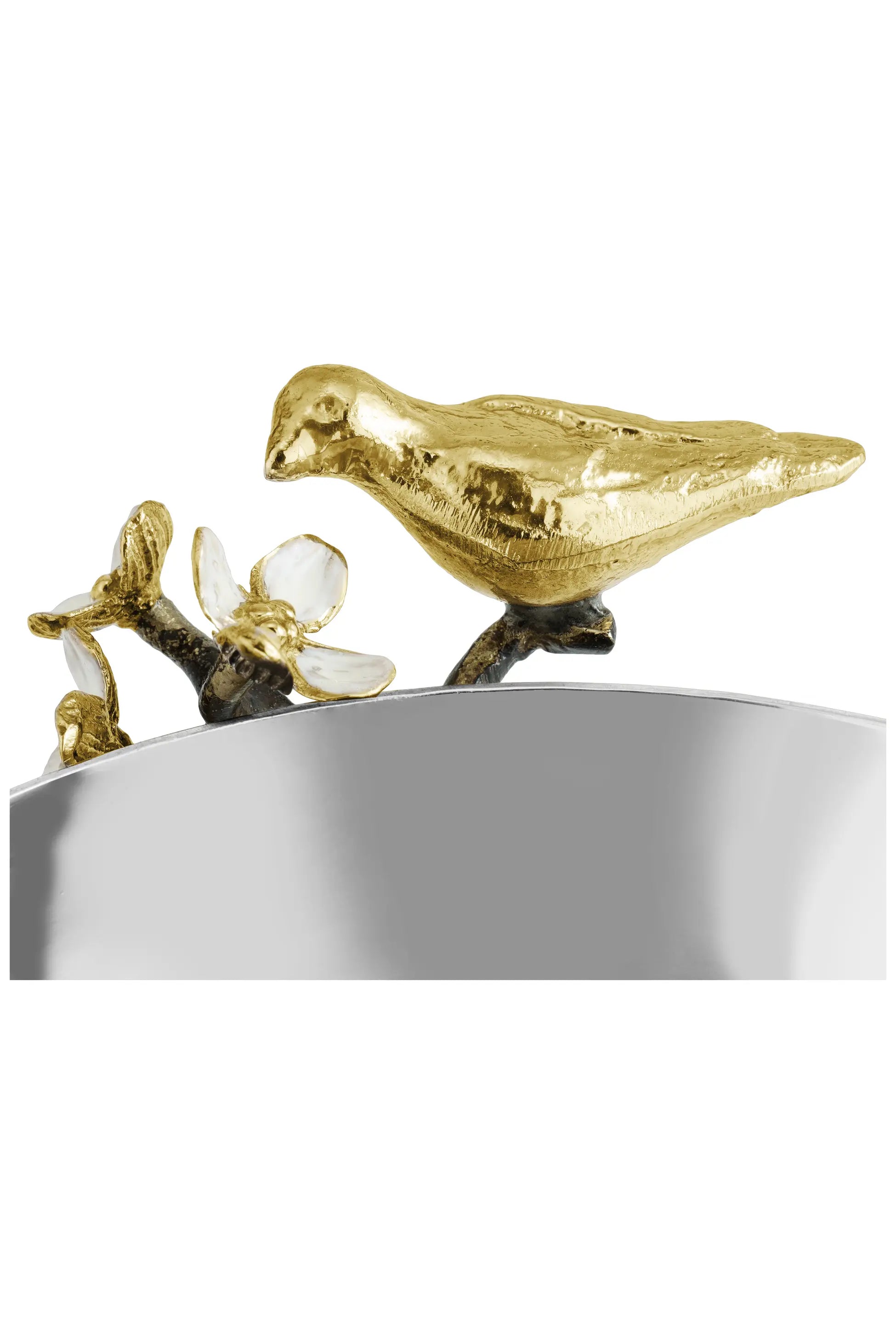 a gold bird on a silver bowl