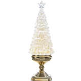 a glass christmas tree on a gold stand