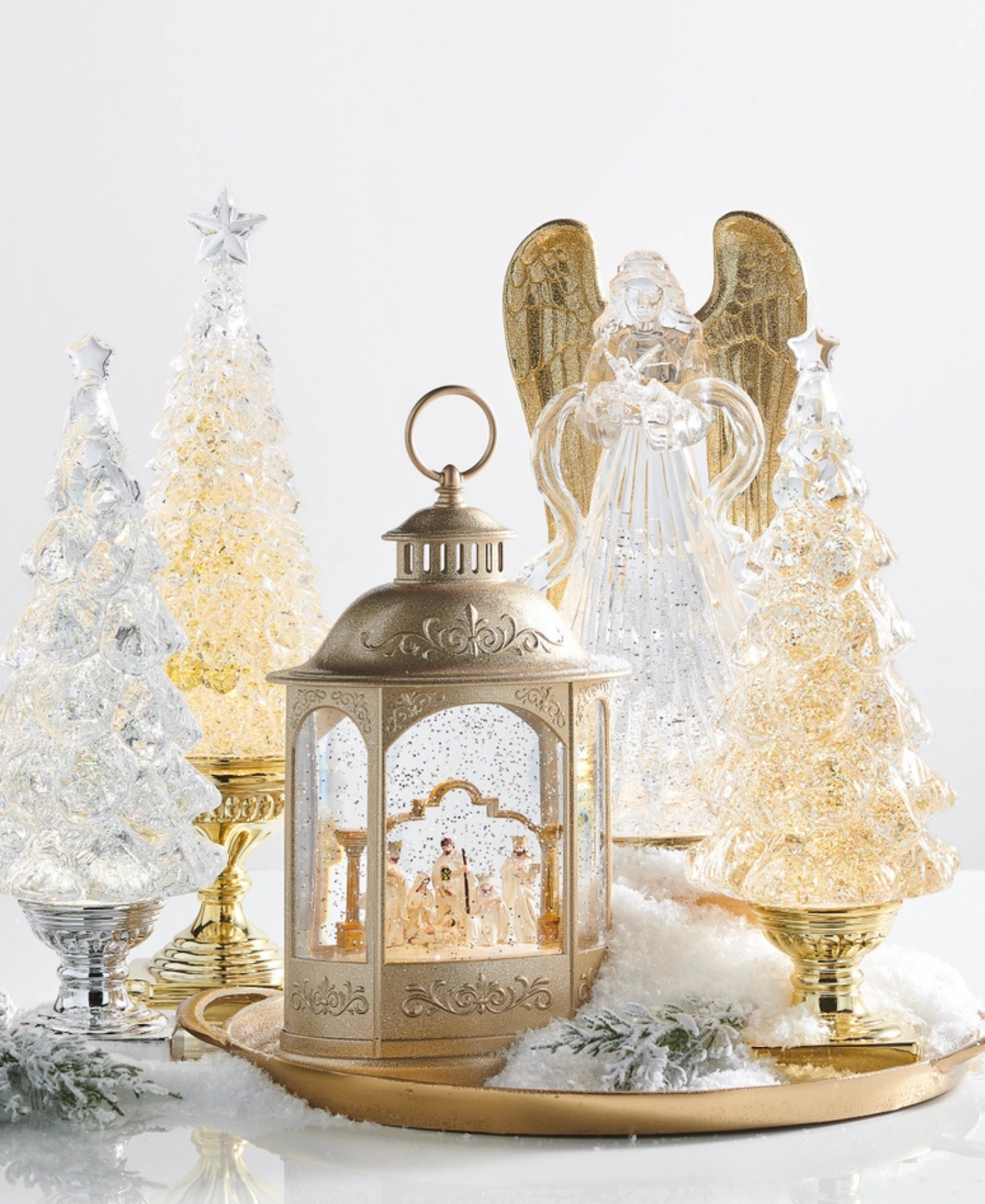 a group of glass trees and a candle holder