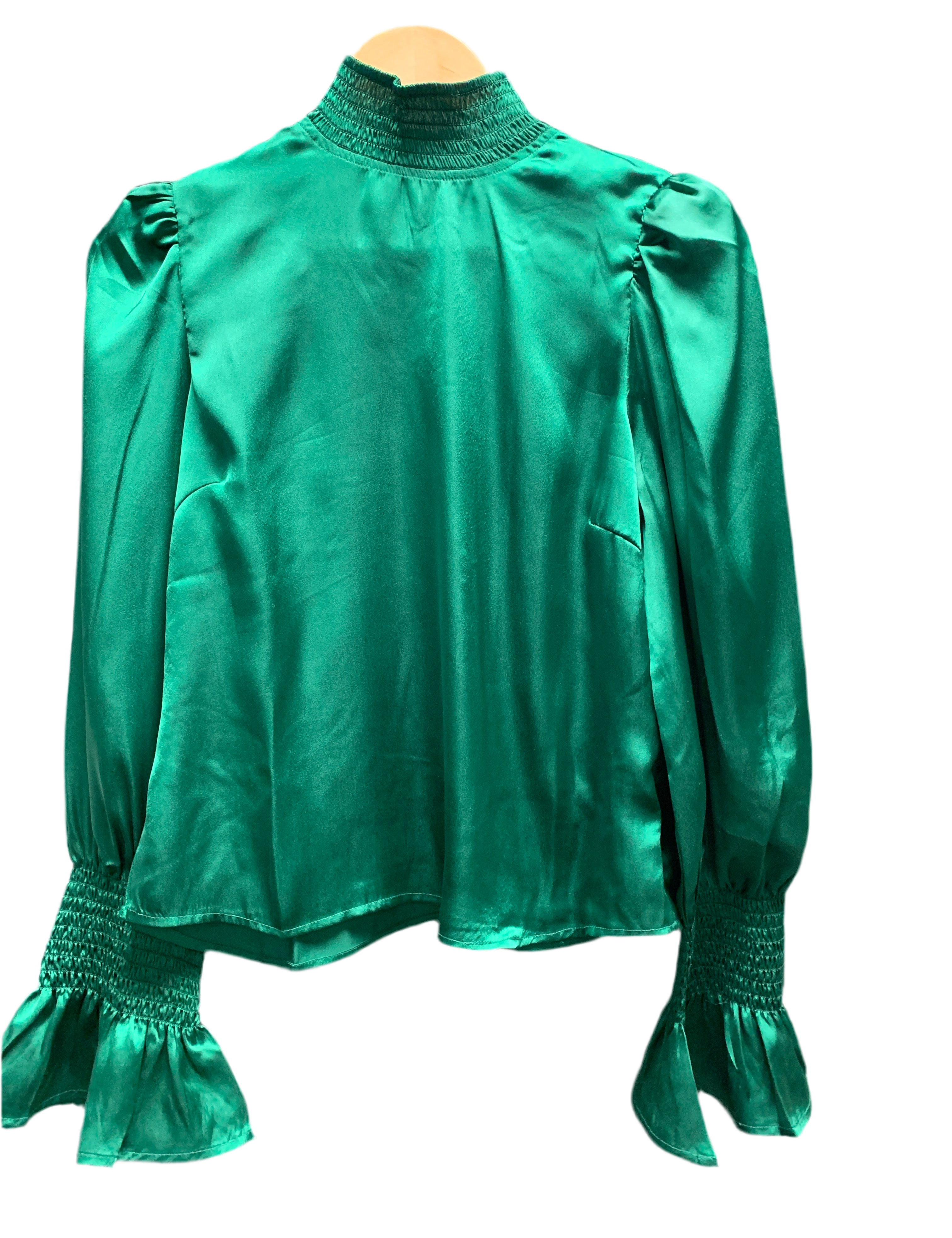 a green blouse with ruffles
