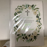 a white book with a cross in it