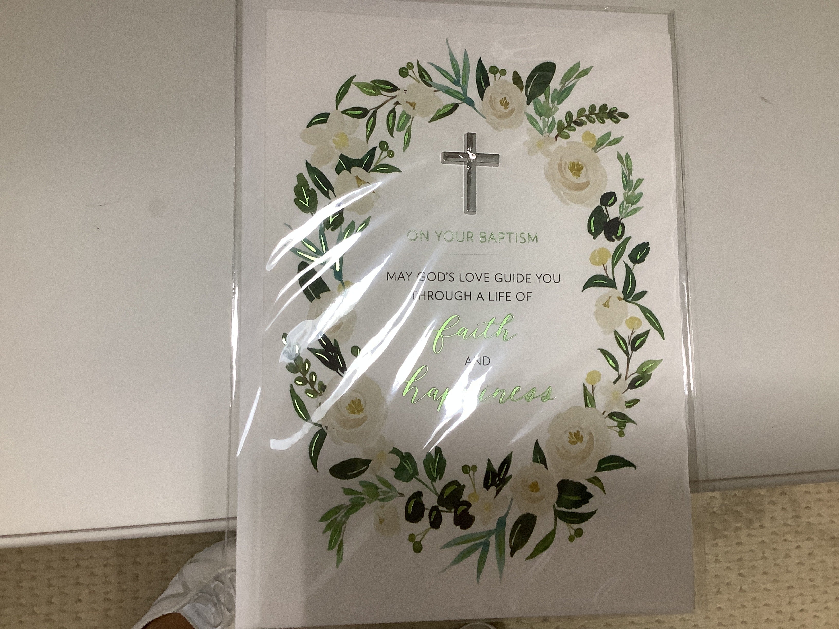 a white book with a cross in it