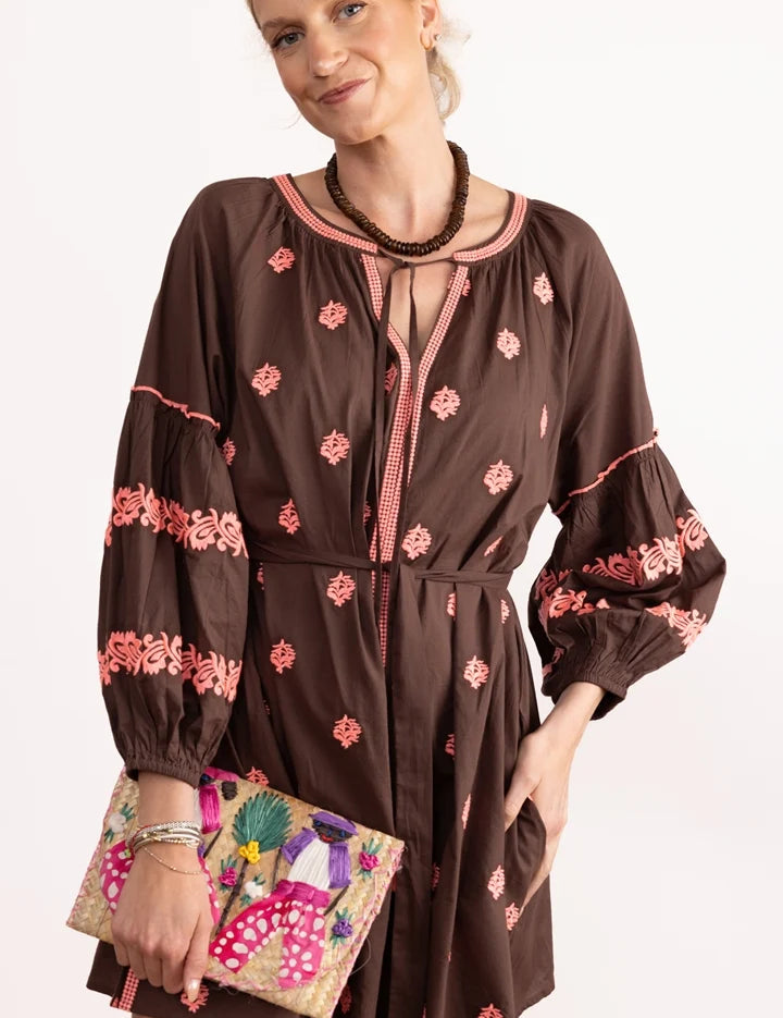 a woman in a brown dress
