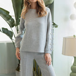 a woman in a grey outfit