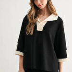 a woman in a black and white shirt