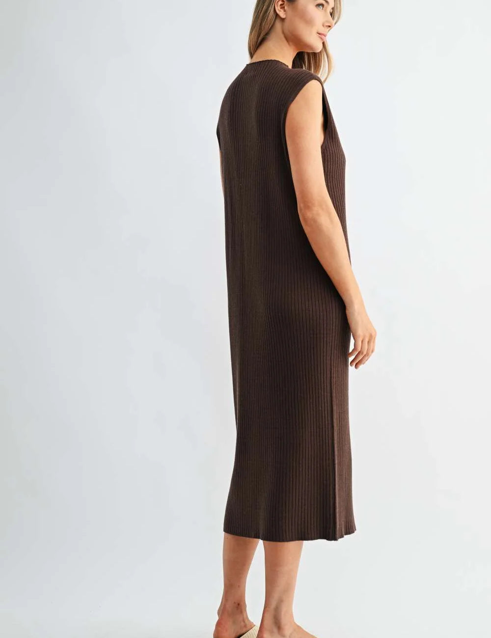 a woman in a brown dress