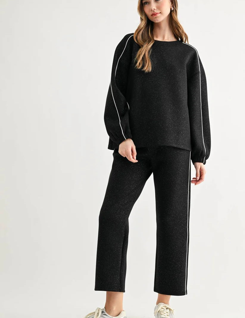 a woman in a black outfit