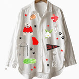 a white shirt with pictures on it