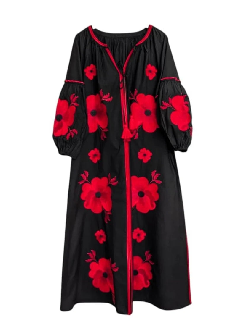 a black and red dress with flowers on it