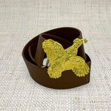 a brown belt with a gold eagle buckle