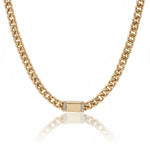 a gold chain with a square object on it