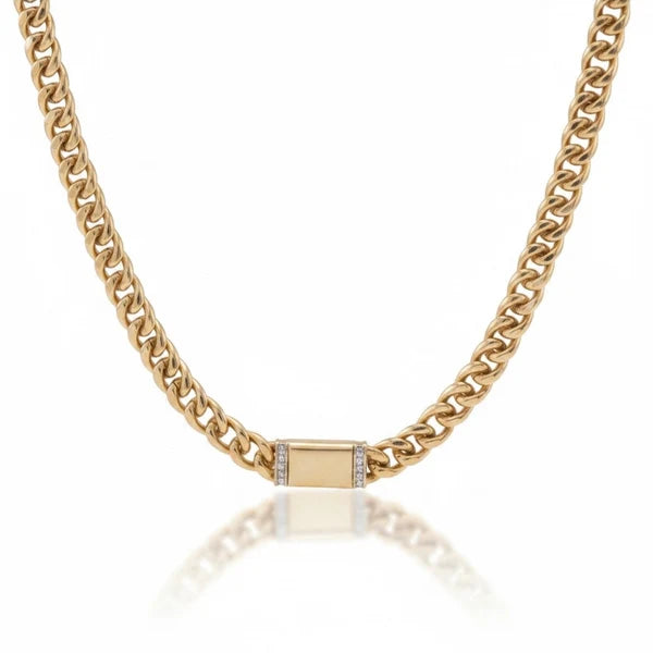 a gold chain with a square object on it