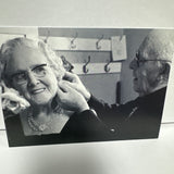 Man Putting A Earring On A Woman Ann