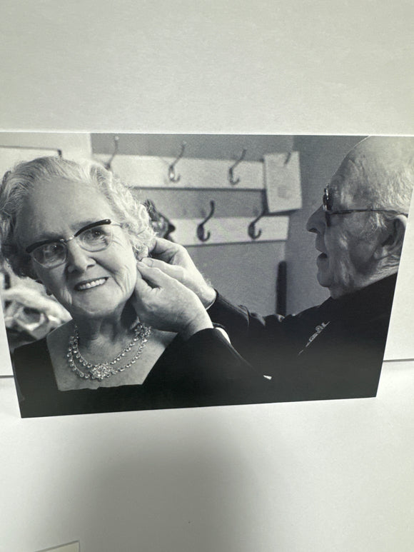 Man Putting A Earring On A Woman Ann