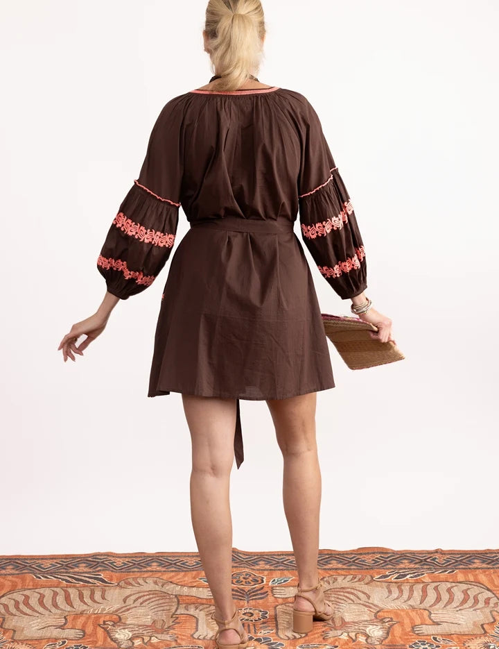a woman in a brown dress