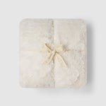 a white square object with a bow