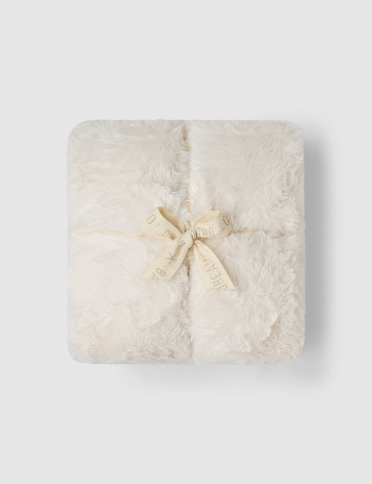 a white square object with a bow