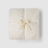 a white square object with a bow