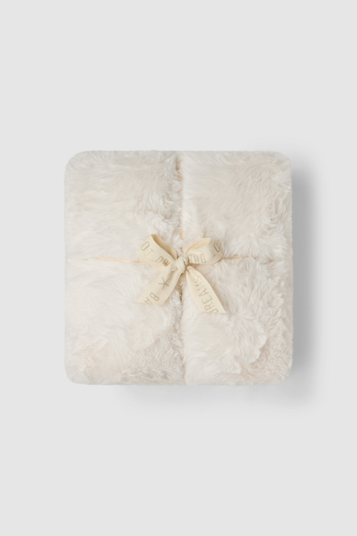 a white square object with a bow